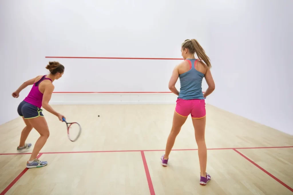 Woman playing raquetball for monthly Friendship Time to Decrease Anxiety and Depression Symptoms